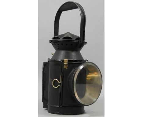 A SR (Eastleigh) four aspect black painted lamp, stamped SER, with glasses and burner. 