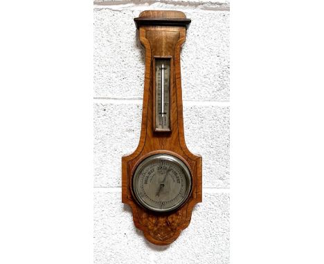 A John Barker &amp; Co. of Kensington barometer thermometer in a walnut case, 55cms high.
