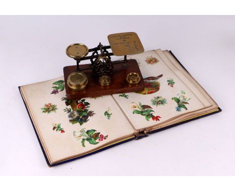 A Victorian scrap album; together with a set of brass and oak postal scales.