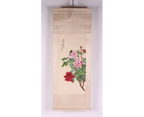 A Chinese scroll painting depicting flowers and calligraphy, 28 by 61cms.