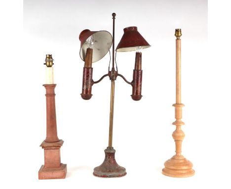 A continental toleware twin-arm table lamp; together with two wooden table lamps (3).