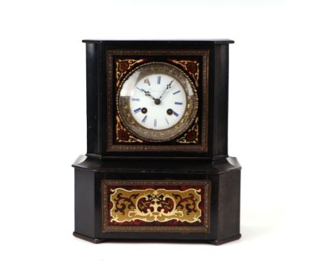 A French boulle cased mantle clock, the white enamel dial with Roman numerals, the movement striking on a bell, 26 by 30cms h