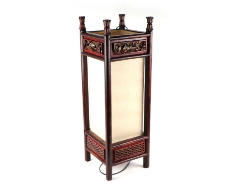 A Chinese lacquered wooden floor lamp, 71cms high.