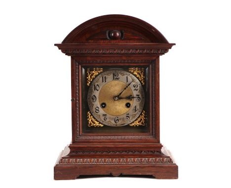 An Edwardian mantle clock, the brass dial with silvered chapter ring with Arabic numerals, fitted with an 30-hour movement st