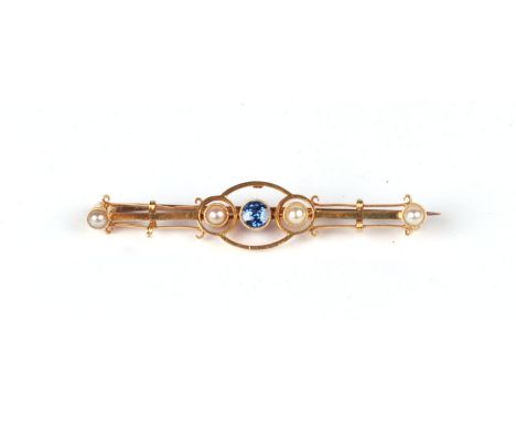 A yellow metal pearl and sapphire bar brooch. 2.7g