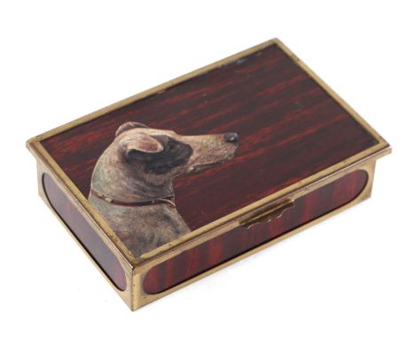 A small trinket or cigarette box with brass mounts and the lid decorated with a portrait of a Jack Russell, 14cms wide.