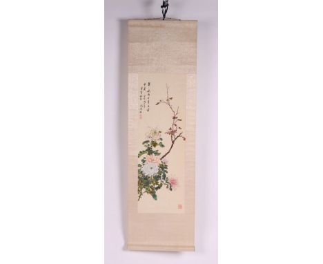 A Chinese scroll painting depicting chrysanthemums and foliage with calligraphy, 24 by 17cms.