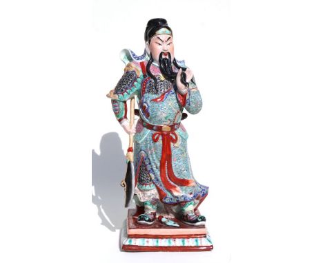 A Chinese figure of Guan Gong with impressed seal mark to the underside, 44cms high.Condition ReportThe tip of the staff is d