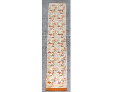 A Japanese Obi sash or Kimono belt decorated with fans and chrysanthemums, 400 by 70cms.