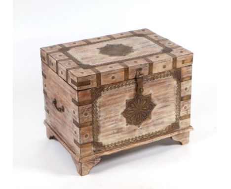 A limed hardwood brass mounted trunk of small proportions, 56cms wide.