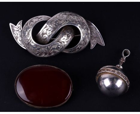 An ecclesiastical silver orb and cross pendant with a ruby set tot he centre of the cross; together with a Scottish silver Ce