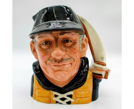 Glazed, hand painted ceramic. The man is in a blue cap and jersey, and yellow lifejacket. The handle is a yacht.Royal Doulton