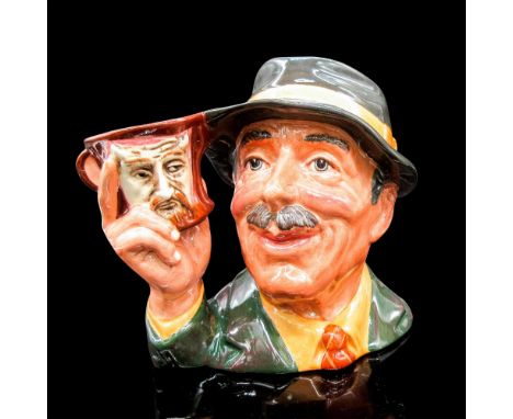 Glazed, hand painted ceramic. Variation One. The man is in a black hat, dark green jacket, and tan shirt. The handle is his h