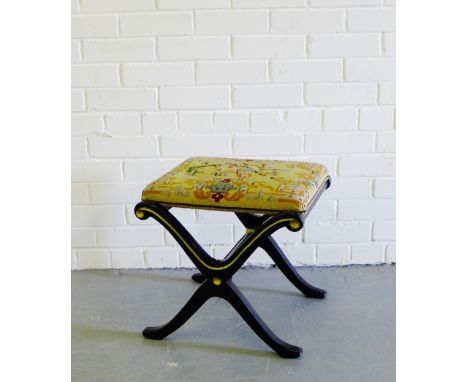 A black painted and gilt x-framed stool with a tapestry top, 42 x 42cm