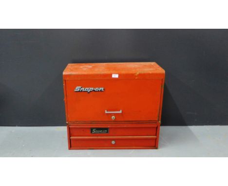 A vintage red snap-on two door toolbox with a red pull up compartment, 60 x 66cm