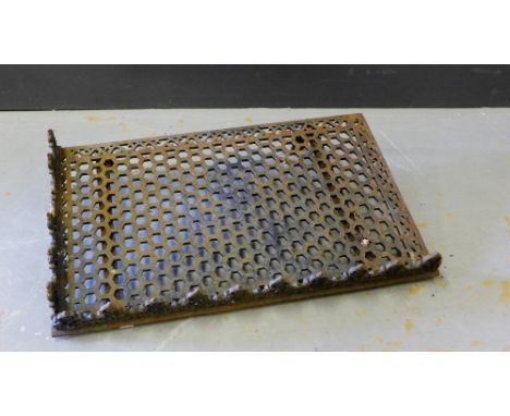 An cast iron garden shelf with honeycomb pattern and foliate frieze, 46 x 76cm 