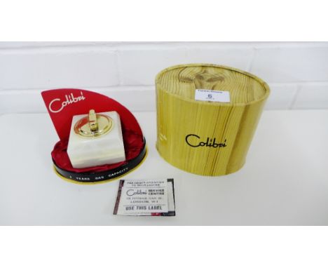 A vintage Colibri onyx table lighter, apparently unused, complete with original box