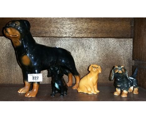 A Group of Beswick and Goebel Figures of Dogs.