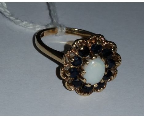 A 9ct Opal and Sapphire Cluster Ring.