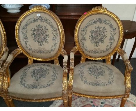 A Good Set of Four Early 20th Century Gilt Armchairs with original tapestry seats.