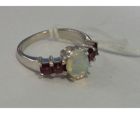 A Silver Opal and Amethyst Ring.