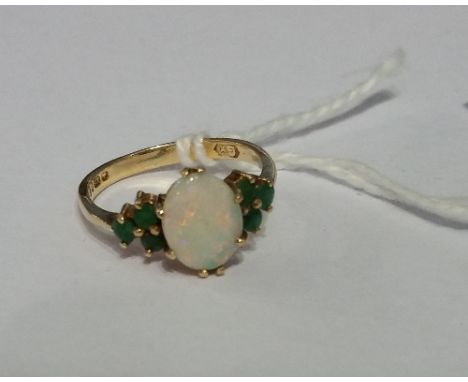 A 9ct Opal and Emerald Cluster Ring.