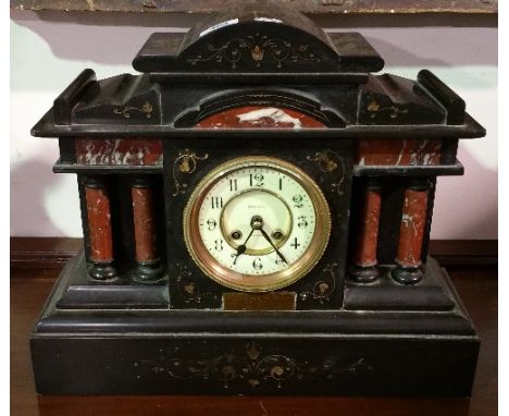 A 19th Century Black Slate and Marble Mantel Clock with Rouge Marble Columns.