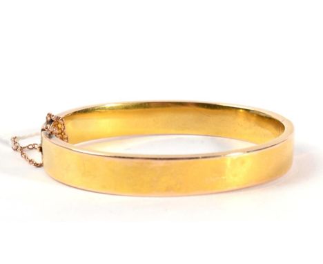 A gold bangle 15.8g. Acid tests as gold