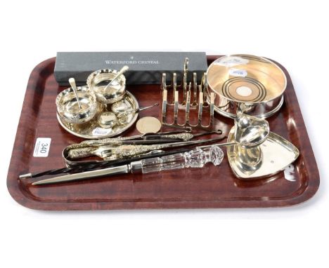 Silver items, to include: a coaster; toast racks; 18th century coin set toddy ladle; button hooks etc; together with various 