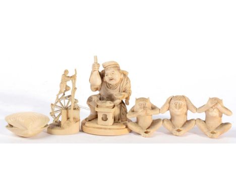 A Japanese carved ivory okimono, late 19th century, depicting a man kneeling holding a bottle and tea bowl; a carved ivory gr