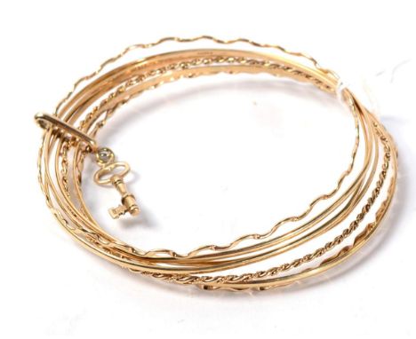 A 9 carat gold multi band bangle, 24g gross