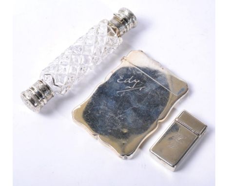 A silver card case Colen Hewer Cheshire, Chester 1902, plain and engraved ''Edy'';  a Victorian silver combination cigar cutt