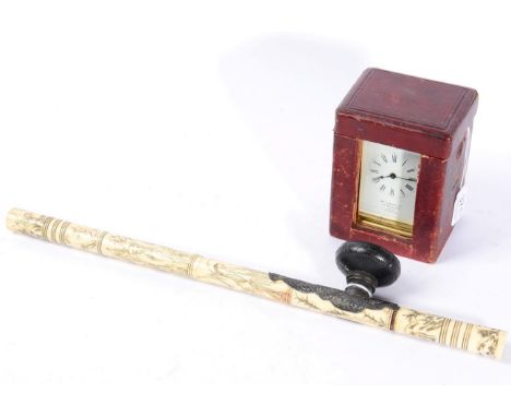 A French brass carriage clock, retailed by Wm Greenwood, with carrying case; together with a Chinese bone and white metal mou