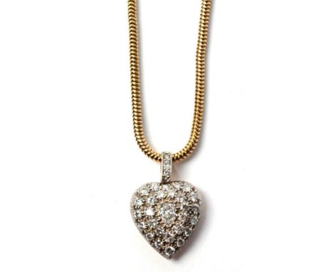 An antique-style diamond heart pendant, pavé set with a pear cut diamond and round brilliant cut diamonds, to a diamond bail,