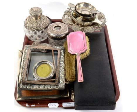 A silver mounted cut glass perfume bottle, a pierced silver footed dish, a silver topped jar, vesta case, pink enamel back ha