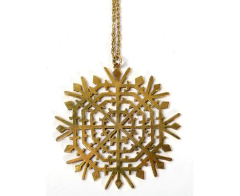 A 9 carat gold snowflake pendant, on chain, measures 5.5cm in diameter, 22.7g