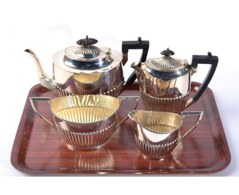 A silver three piece tea service, Walker &amp; Hall, Sheffield 1900/01, and a matched hot water jug, James Dixon &amp; Sons, 