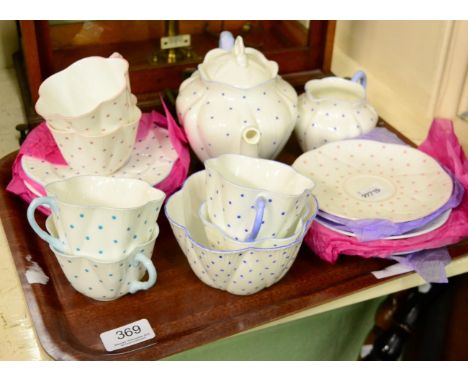 A Shelley harlequin spotted teaset, comprising six cups, six saucers, cream jug, teapot and associated sugar bowl (qty)