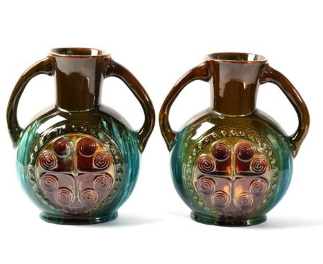 Two Linthorpe pottery twin handled vases, designed by Christopher Dresser, shape no. 337