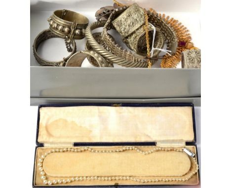 Assorted Iranian jewellery including three bangles; three chokers; a gilt necklace and a simulated pearl necklace, together w