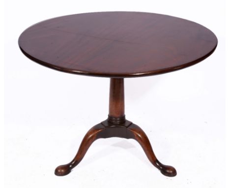 A GEORGE III MAHOGANY TRIPOD TABLE, the circular top with bird cage support and on turned central tapering column and hoof fe