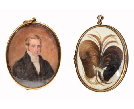 AN OVAL MINIATURE PORTRAIT of a gentleman in black top coat and white stock on ivory, the back set with a lock of hair within