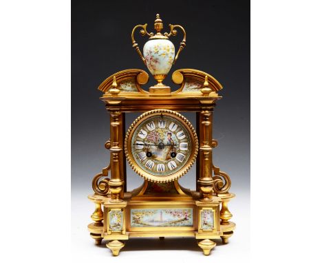 A FRENCH ORMOLU AND PORCELAIN MANTEL CLOCK with striking mechanism, figure decoration and urn finial, 37cm high
