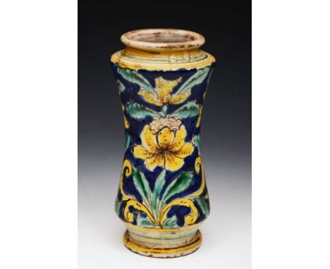 AN 18TH CENTURY ITALIAN MAIOLICA ALBARELLO of waisted form with yellow lily decoration on a turquoise and cobalt blue ground,