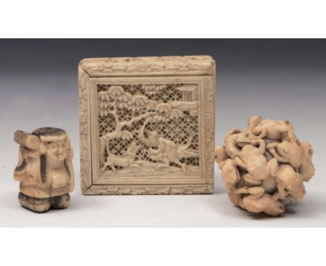 A JAPANESE CARVED IVORY OKIMONO, late 19th/early 20th Century, carved as a ball of entwined toads and a snake, 3.5cm diameter