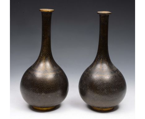 A PAIR OF SOUTH EAST ASIAN CLOISONNÉ ENAMEL BOTTLE VASES with overlapping wirework design on a black ground, 25.5cm high