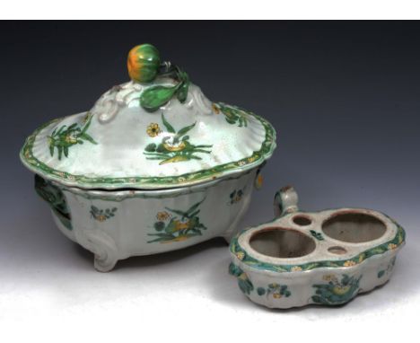A FRENCH FAIENCE TUREEN AND COVER with green and yellow glaze foliate decoration and fruit finial, 30cm wide; together with a