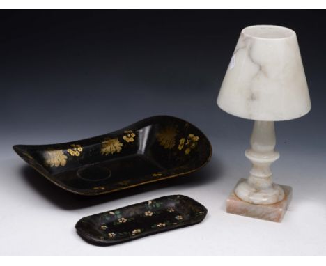 A TOLEWARE BREAD TRAY with gilded decoration on a black ground, 36cm long; a similar snuffer tray, 23cm long; and an onyx tab