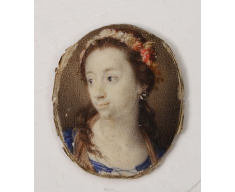 AN EARLY 19TH CENTURY OVAL MINIATURE PORTRAIT OF A LADY, with flower adorned long brown hair and blue dress, painted on ivory