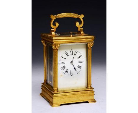 A FRENCH BRASS CARRIAGE CLOCK with pull repeat and presentation inscription dated 1906, the case with fluted pillar support, 